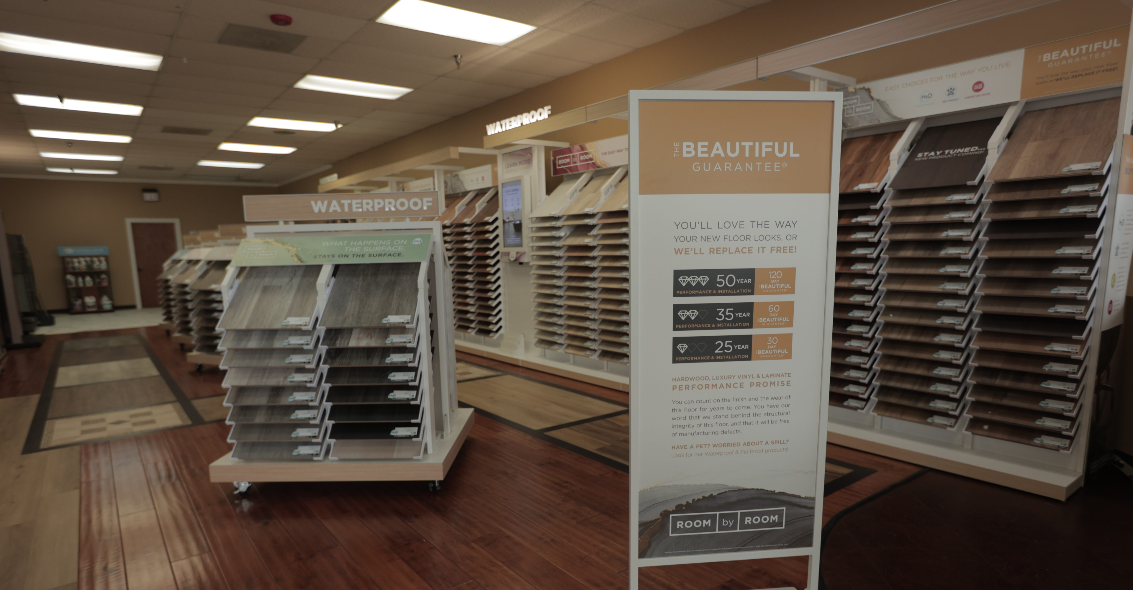 CT Carpet One flooring showroom with The Beautiful Guarantee display