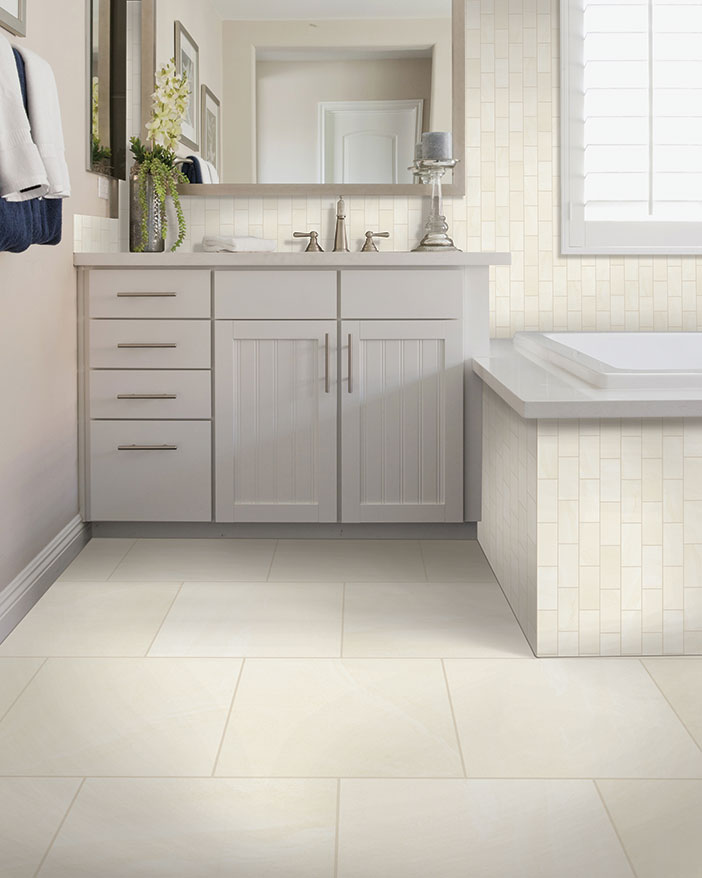 white and gray bathroom with large-scale floor tile and subway tile backsplash